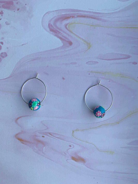 Blue earrings. Polymer clay earrings. flower earrings. Polymer clay flower beads in a variety of colours on silver plated hoops. hoop earrings.
