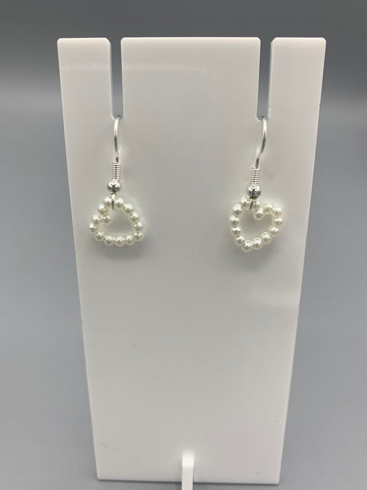 cute earrings. heart earrings. Pearl effect heart charm on silver plated hooks. fashion earrings. cute earrings for girls.