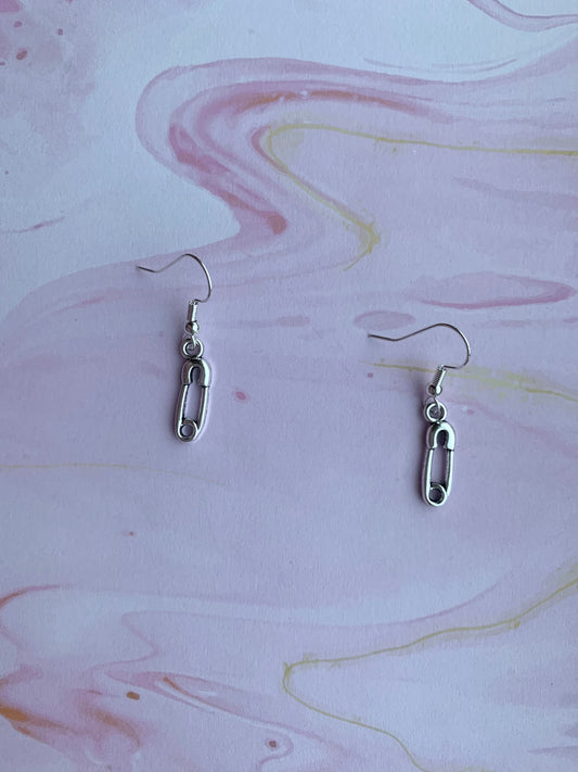 goth earrings. emo earrings. Silver coloured alloy safety pin charm on silver plated hooks. hook earrings. funky earrings.