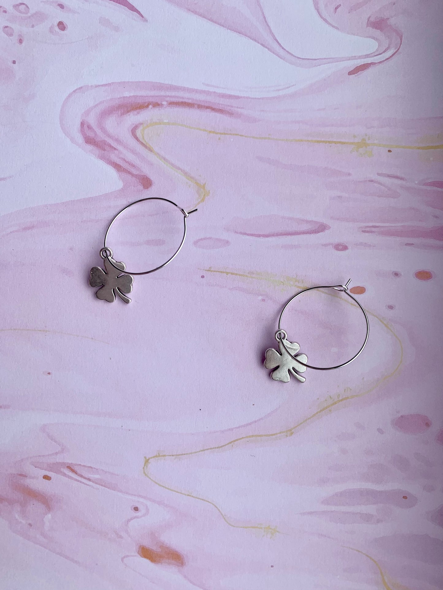 Lucky earrings. irish earrings. hoop earrings. Silver coloured alloy shamrock charm on silver plated hoops. st patricks day earrings. four leaf clover