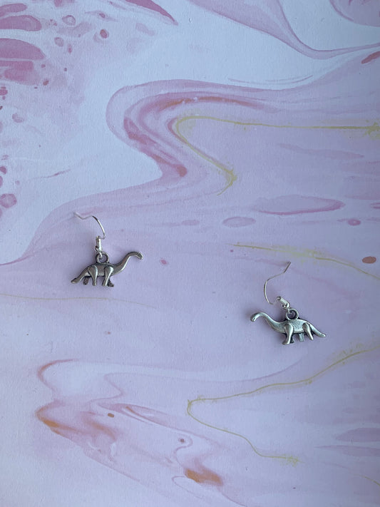 Alloy metal silver coloured brontosaurus charm on silver plated hoops. Dinosaur earrings. Animal earrings. Novelty earrings. 