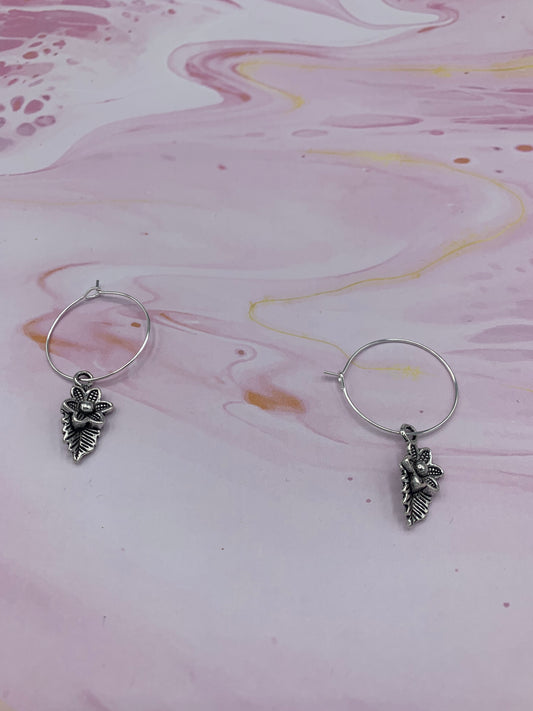 Flower earrings. Silver coloured alloy flower with leaf charm on silver plated hoops. Mothers day earrings. Earrings for women. 