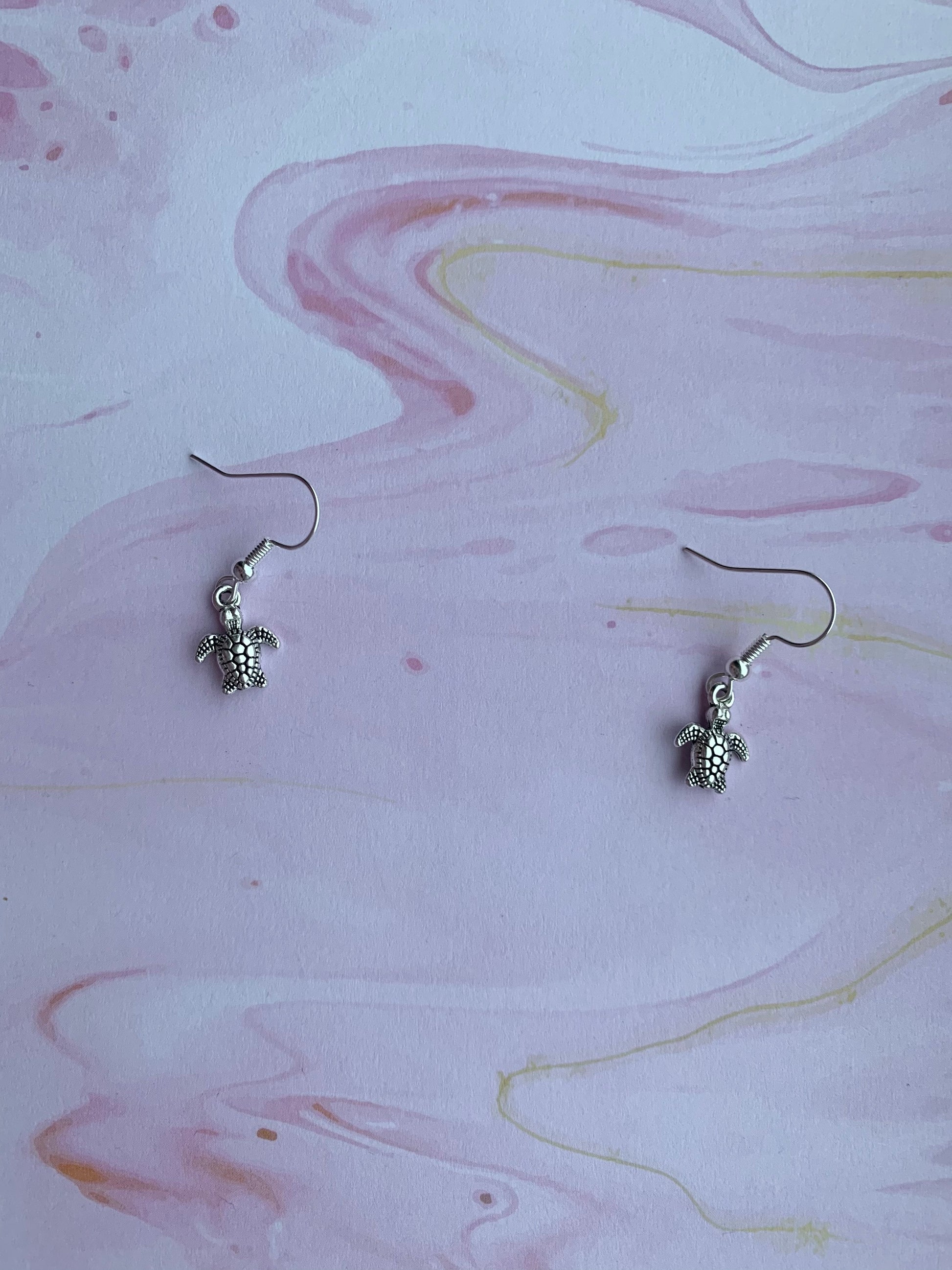 Cutest tiny turtle silver coloured alloy charm on silver plated hooks. dangle earrings. silver earrings. turtle earrings. animal earrings.